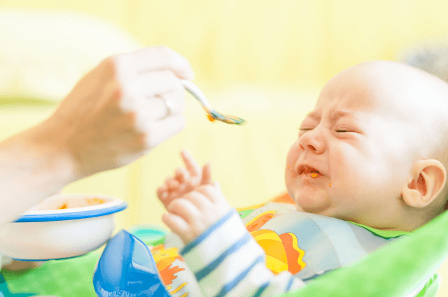 Baby crying while eating solid